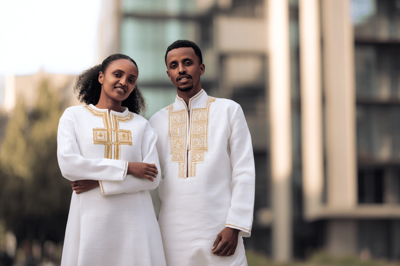 Ethiopian wedding couple in matching white traditional dress with gold embroidery in modern Addis