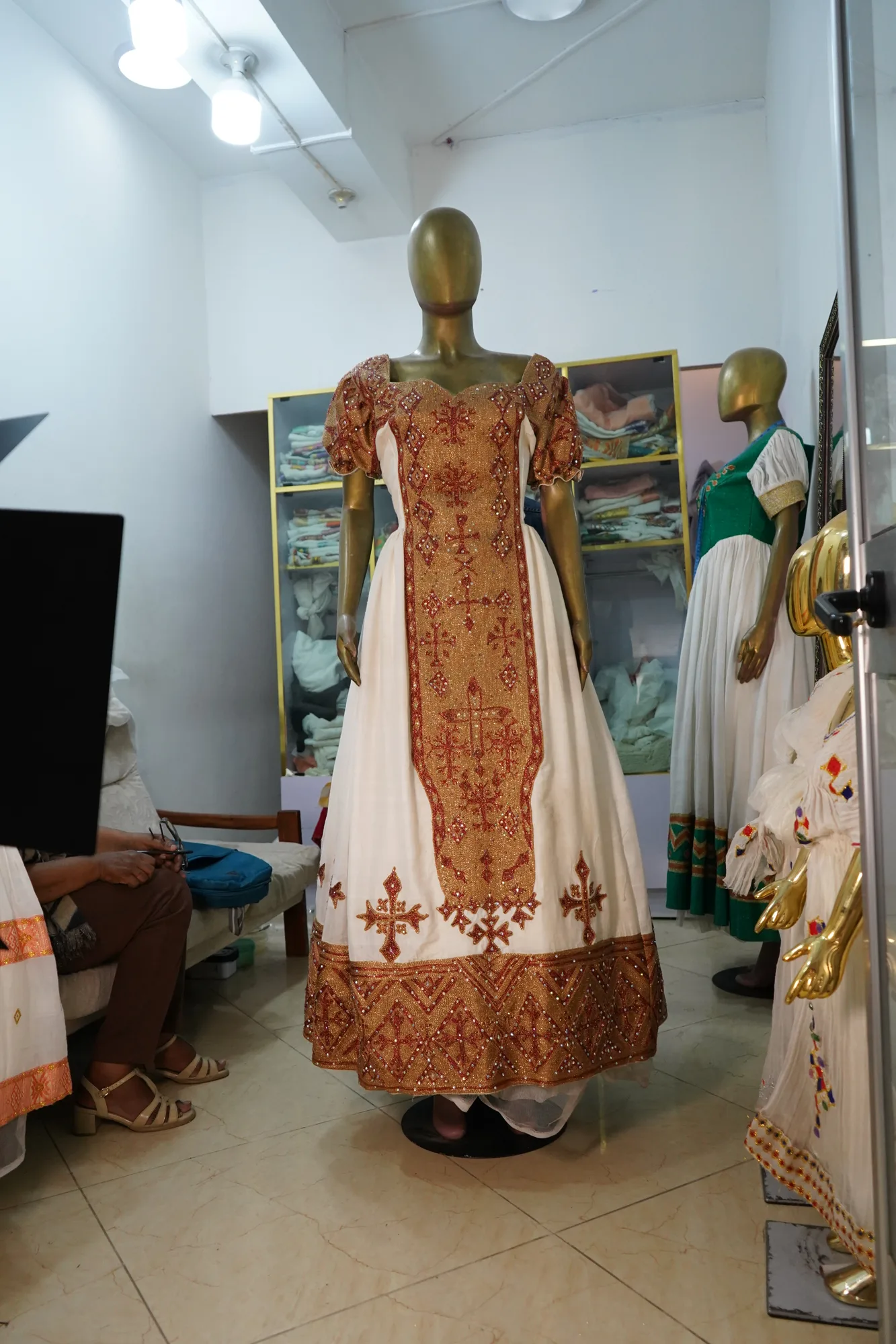 Hand woven habesha kemis decorated with golden woven embroidery